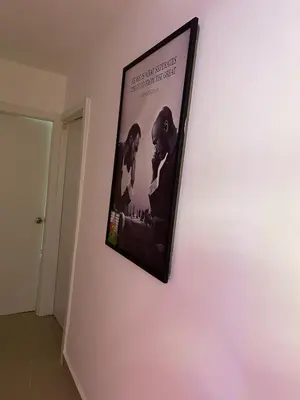 a picture hanging on a wall in a room at Apartamento Bello y Amueblado in Jacagua