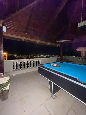 a pool table in a room with a view at Cozy Apt with Puerto Plata view in San Felipe de Puerto Plata