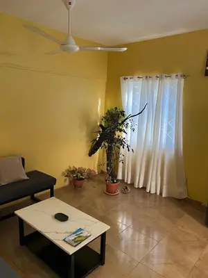 a living room with a couch and a table at Garden House in Las Galeras