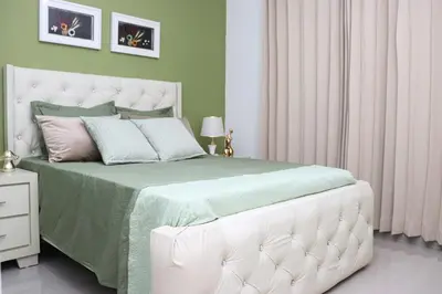 a bedroom with a large bed with a white headboard at Lux 3BR Oasis With Gazebo & Pool in Pontezuela Arriba