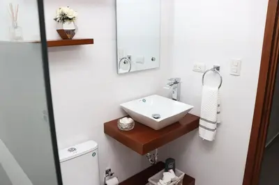 a bathroom with a sink and a mirror at Lux 3BR Oasis With Gazebo & Pool in Pontezuela Arriba