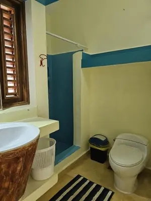 a bathroom with a tub and a toilet and a sink at Villa with Stunning Ocean View, Infinity pool in Las Terrenas