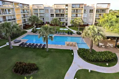 an aerial view of a resort with a pool and palm trees at 404 y 504 Luxurious PH with Jacuzzi near the Beach in La Laguna