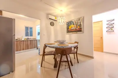 a kitchen and dining room with a table and chairs at Oasis cerca del mar #2 in Monte Adentro