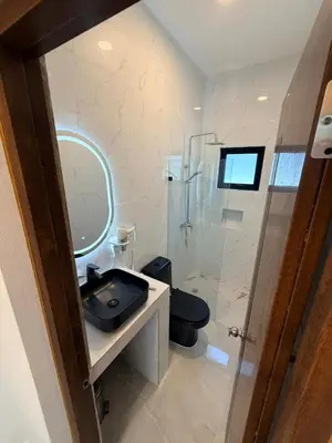 a bathroom with a sink and a toilet and a mirror at Taina village in Las Terrenas