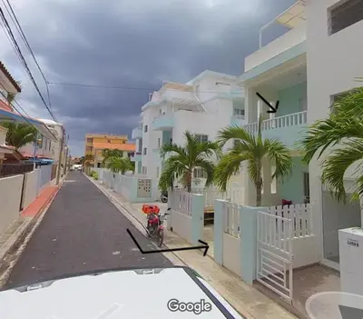 a bike parked on a street next to a building at Ilaria Bayahibe By Mireya in Bayahibe