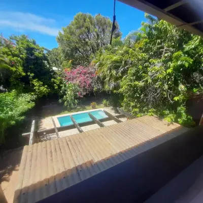 a view of a swimming pool in a garden at Beautiful, fresh peaceful Villa in Sosúa