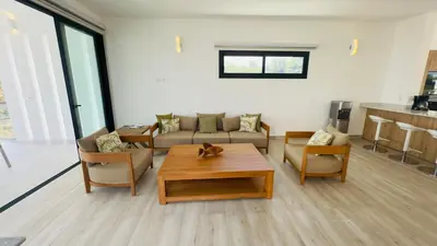 a living room with a couch and a coffee table at Oceanview Villa With King Beds in Las Terrenas