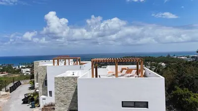 a view of the ocean from the top of a building at Oceanview Villa With King Beds in Las Terrenas