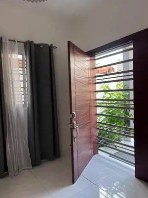a wooden door with a window in a room at Casa amueblada en San Cristóbal in San Cristóbal