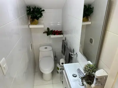 a small bathroom with a toilet and a sink at Casa en la Autopista de San Isidro in Hainamosa