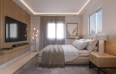 a bedroom with a bed and a flat screen tv at Los Castillos Resort in Los Altos de Jalisco