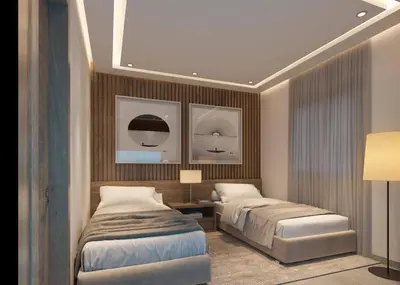a bedroom with two beds and a lamp in it at Los Castillos Resort in Los Altos de Jalisco