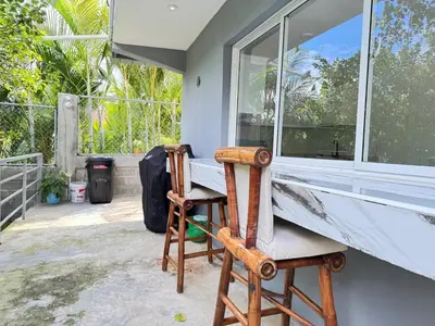 a room with a desk and a chair next to a window at villa el naciente in La Cuaba