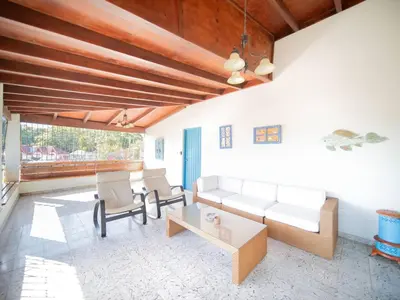 a living room with a couch and a table at 2BR Colonial Penthouse in Sosua next to BEACH in Sosúa