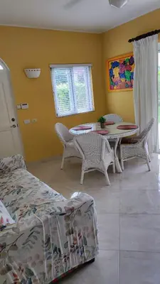 a room with a table and chairs and a dining room at Caribe Home Dominicus Ginepro 3 in La Laguna