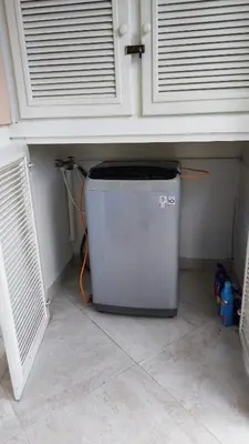 a small refrigerator sitting under a counter in a room at Caribe Home Dominicus Ginepro 3 in La Laguna
