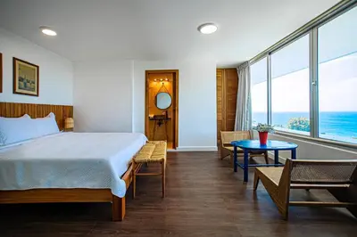 a bedroom with a bed and a view of the ocean at 5 mins from beach, Hilltop villa with pool in La Pared