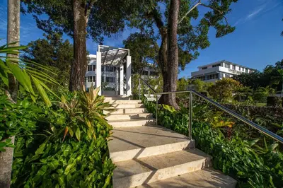 a set of stairs leading up to a building at 5 mins from beach, Hilltop villa with pool in La Pared