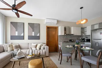 a living room with a couch and a table at 404-C Luxurious Apartment 5 Minutes from the Beach in La Laguna