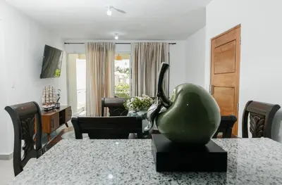 a living room with a green sculpture on a table at Caribey2 APT 3D1 in Las Terrenas