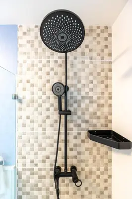 a shower head on a stand in a bathroom at Beach Escape -Pool Patio -Free Parking -Pets in Villas del Mar