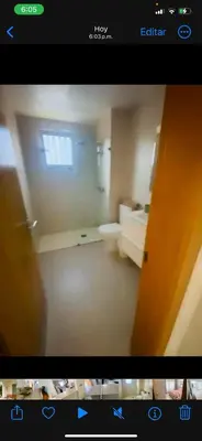 a picture of a room with a television screen showing a bathroom at Apartamento en punta cana close to the beach in Punta Cana