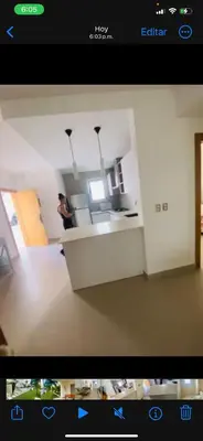 a view of a kitchen with a person in the kitchen at Apartamento en punta cana close to the beach in Punta Cana