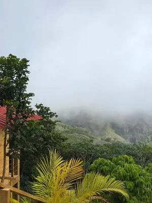 a view of a mountain with clouds in the sky at Mountain refuge - Cabin with wonderful views! in La Búcara