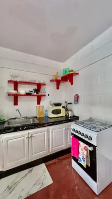 a kitchen with a stove and a sink in it at Apartamento Mirador de La ciudad in Jarabacoa