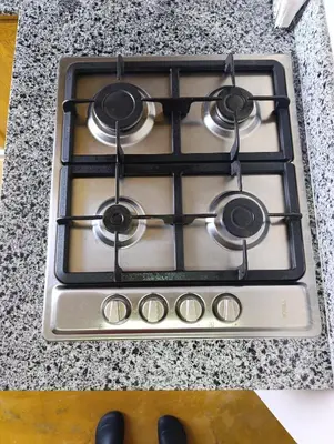 a stove top with four burners on a counter at Apart hotel Costa Verde#7 con cama Queen in Las Galeras
