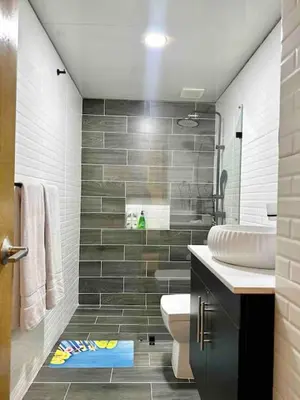 a bathroom with a toilet and a sink at Cozy Beach Condo Great Views in Guayacanes