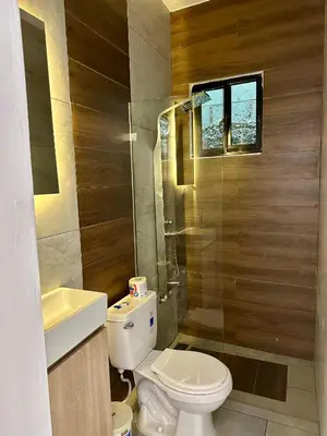 a bathroom with a toilet and a sink at Residencial Fe y Esperanza in Pedernales