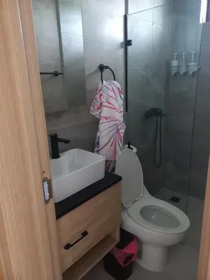a bathroom with a toilet and a sink and a shower at Apartamento en Vista Cana in Batey San Germán