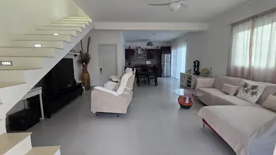 a living room with a couch and a staircase at Acogedora Casa privada in Bayahibe