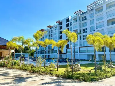 a row of palm trees in front of a building at Fortunity1 Escape, Puerto plata Playa Dorada in San Felipe de Puerto Plata