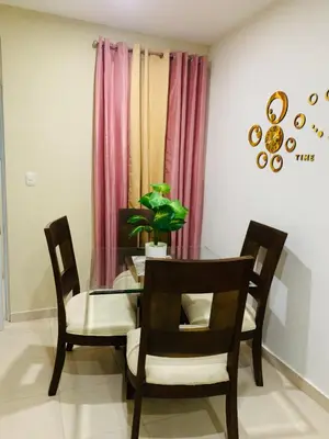 a dining room with a glass table and chairs at Apartamento Familiar 7 in Colorado