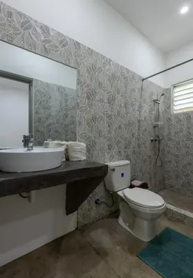 a bathroom with a sink and a toilet at El Patio de Lucia Residencia in Las Terrenas