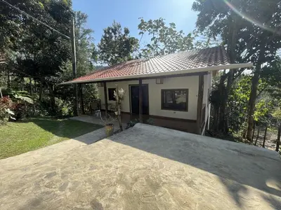 a small house with a patio in front of it at Villa Jarabacoa Monte Bonito in Jarabacoa