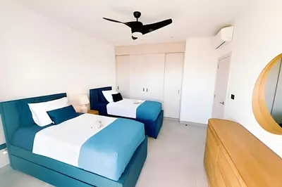 a bedroom with two beds and a ceiling fan at Aqua Esmeralda by Advantage Club in La Laguna