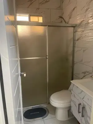 a shower stall in a bathroom with a toilet at Furnished apartment available in La Romana