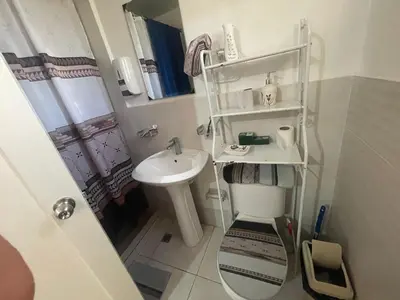 a small bathroom with a sink and a toilet at Apartamento en Caleta, La Romana in La Romana