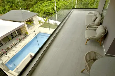 a balcony with a view of a swimming pool at Best Friends Hoyo Cacao in Las Terrenas