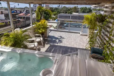 a hot tub on the roof of a building at Colonial House in Santo Domingo