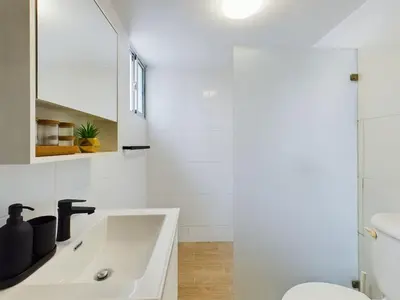 a bathroom with a sink and a toilet at The Ocean Front Palomar in Punta Cana