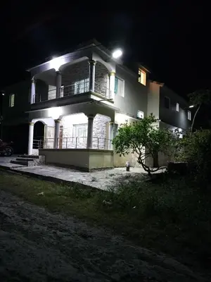 a large house at night with lights on it at Villa Magante in La Yagua