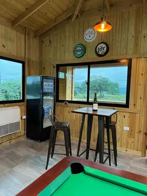 a ping pong table in a room with a pool table at Villa con piscina Infinitive in Concepción de La Vega