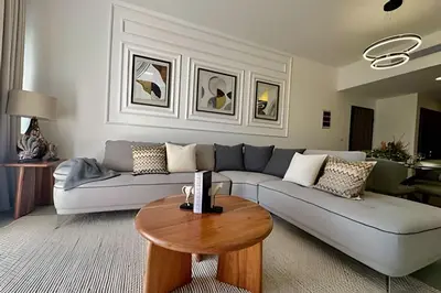 a living room with a couch and a table at Adult Only Luxe Retreat @ Coral Bay 2 in Punta Cana