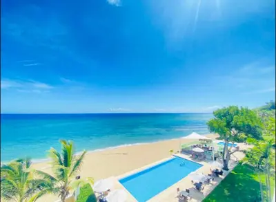 an aerial view of a beach with a swimming pool at Beachfront Luxury Penthouse in Sosúa