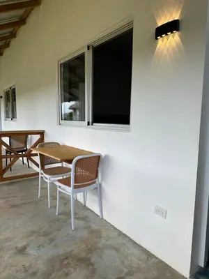 a table and chairs in a room with a window at Habitacion 3 en Dani's Guest House in Las Galeras